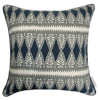 Decorative pillow cushion with a blue and green grey geometric pattern on a cream background