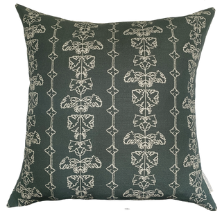 A slate green square cushion cover with an intricate off white line drawing design.