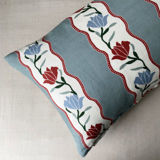 Decorative pillow with floral pattern on a light background